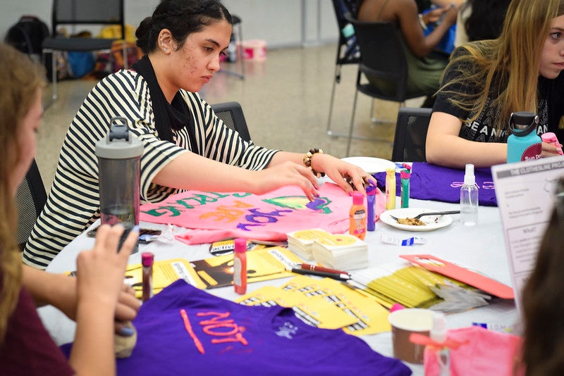 Women make T-shirts at Women's Welcome