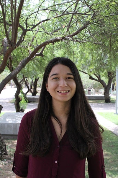 Cecilia Alcantar portrait in front of trees