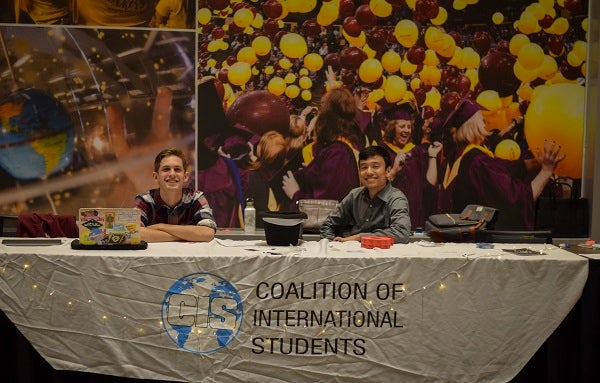 Coalition of International Students students at a table at ASU's Student Pavilion