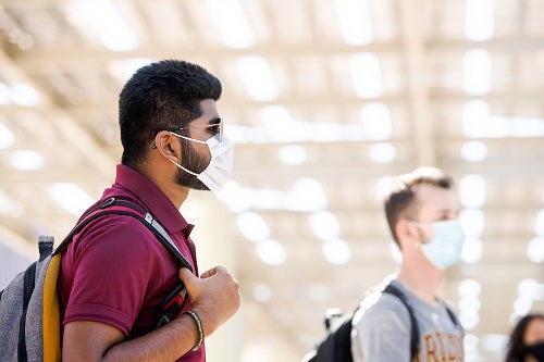 Students in masks in front of the Memorial Union at ASU's Tempe campus