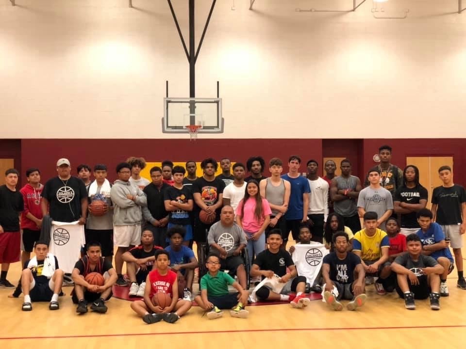 David Solano and his after-school program for Phoenix youth pose for a picture 