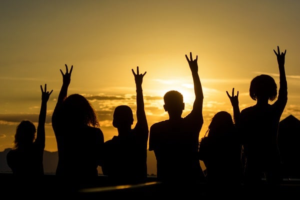 Silouettes of students giving the ASU Forks Up sign