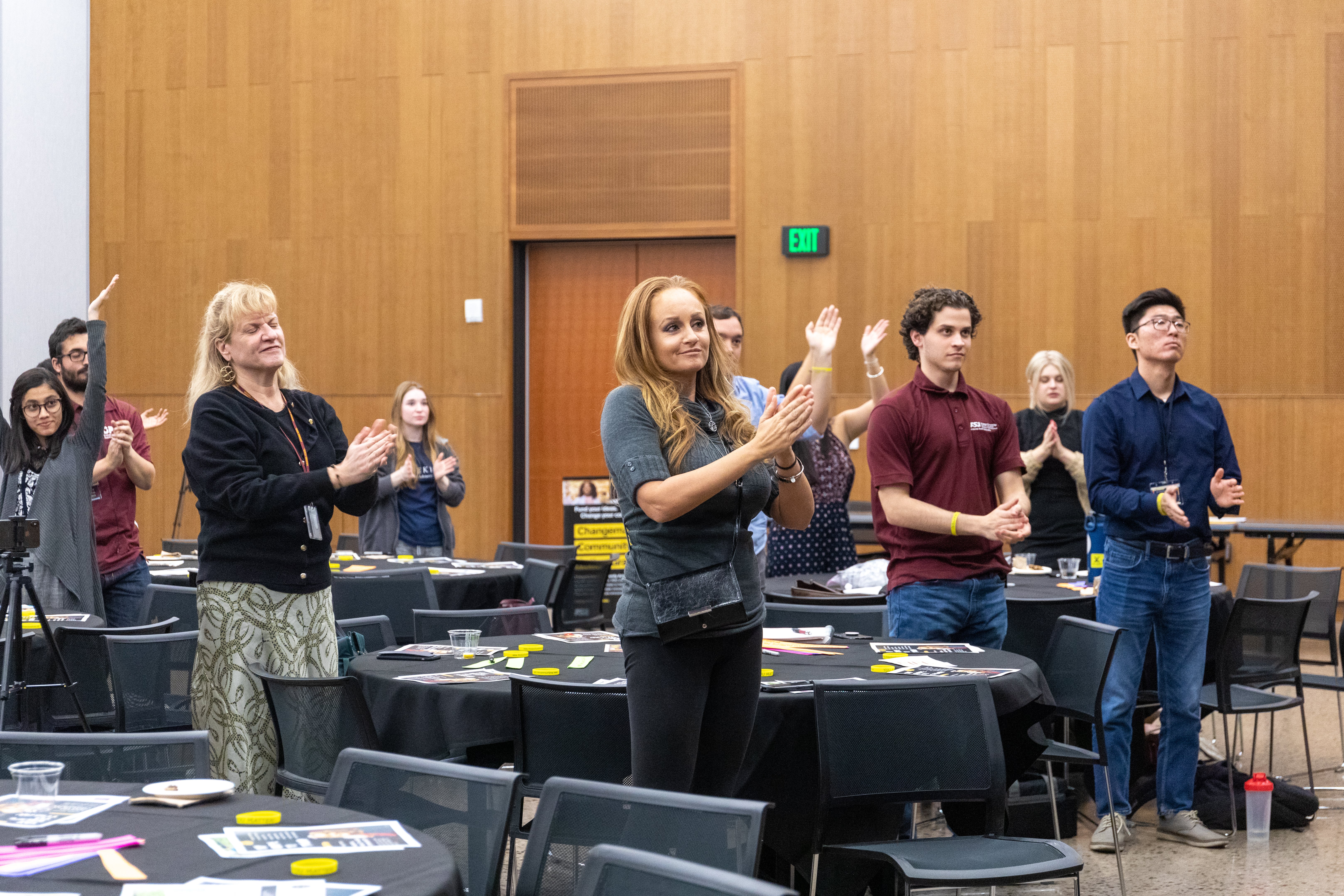 Participants of the Mental Health Conference applauding the end of the conference.