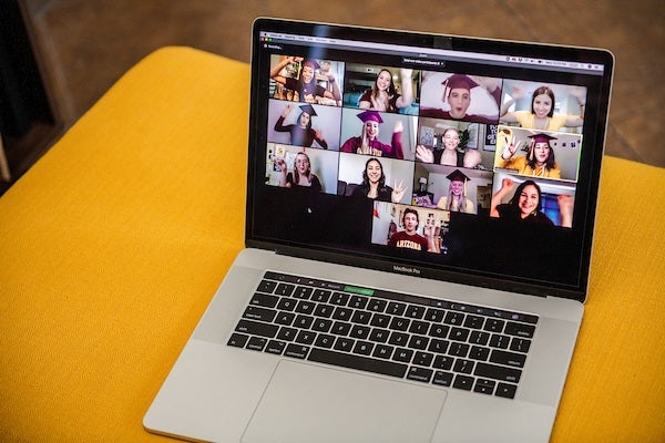 A laptop with ASU students visible in a Zoom room